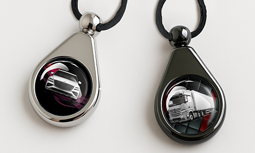 Chrome and black car perfumes featuring a car and truck design
