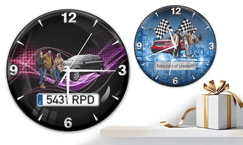 Two wall clocks with group car scenes: left with black car and purple waves, right with red and black cars, racing flags, and blue background