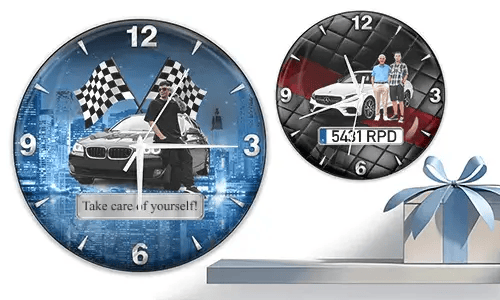 Two wall clocks with white cars and male figures: left with cityscape and racing flags, right with quilted red-black background