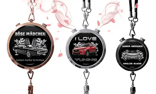 Three round pendants with car themes on black backgrounds. Left: vintage car with German text and checkered flags. Center: red SUV, 