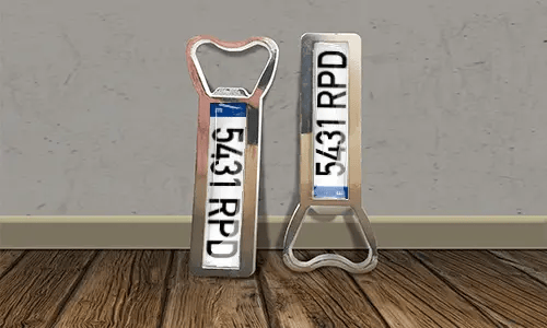 two bottle opener magnets on the floor