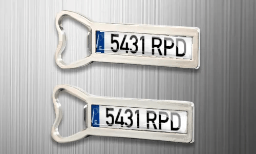 two magnet bottle openers on the fridge