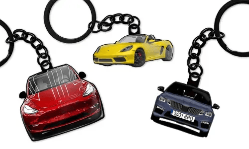 Personalized keychains displaying three different car models in red, yellow, and blue