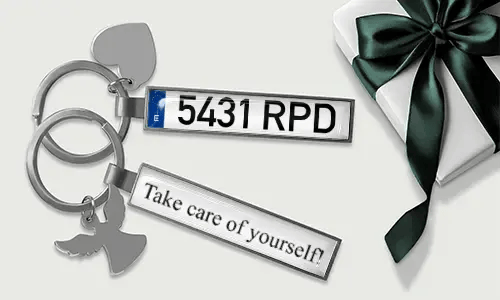Metal license plate keychain with heart and angel wing charms