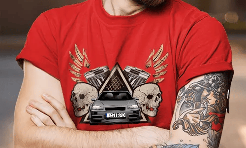 Red T-shirt with white SUV graphic, flanked by skulls and pistons, golden wings behind, worn by tattooed person