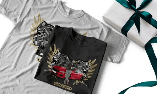 Two T-shirts with red sports car, golden wings, skulls, and BORN TO DRIVE banner, next to gift box
